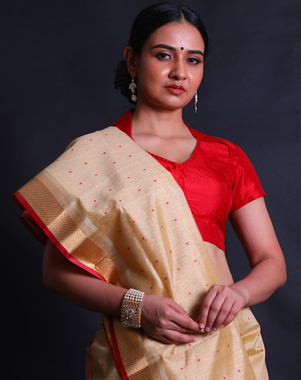 The beige blended saree with small bandhani print in red sounds elegant and versatile.- BLN01277