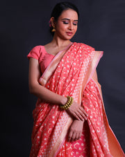 The peach kora cotton saree with zari and thread woven in different designs.- BSK010448