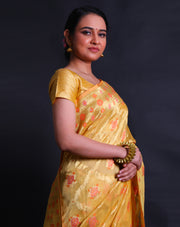 The mustard Banarasi kora tissue saree with gold zari and thread woven designs,- BSK010591