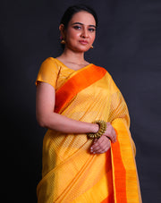 The yellow Banarasi kora saree you described sounds exquisite and vibrant.- BSK05679