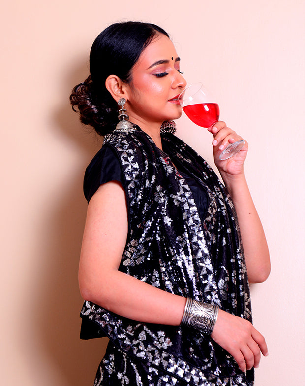 The black blended georgette saree with silver and black sequence embroidery sounds absolutely glamorous - BLN01320