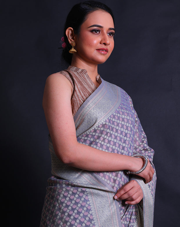 The grey Banarasi cotton saree you're describing sounds sophisticated and visually appealing.- FCT011110