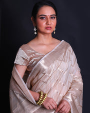 The beige fancy cotton saree, embellished with a zig-zag design woven in zari,- FCT011144