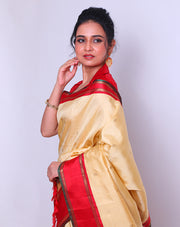 A Kanjivaram Cream Silk saree with self body woven with real Zari buttis all over sounds absolutely luxurious - KSL02709