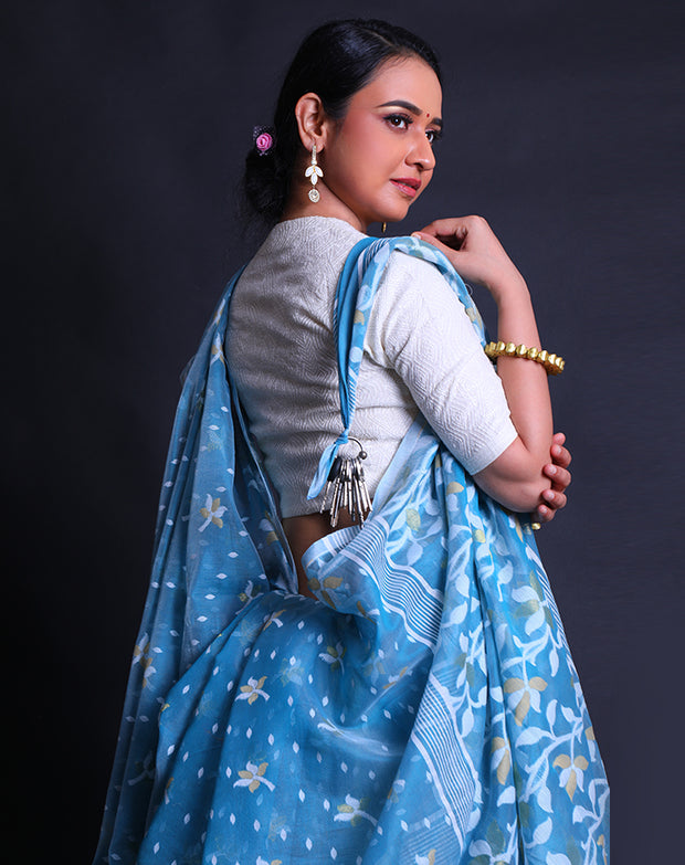 The blue cotton saree adorned with Daccai design woven intricately all over the drape,- FCT011111