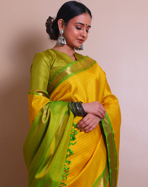 A Yellow Uppada real zari saree is adorned with small buttis of silver and gold zari scattered throughout the drape, - KSL02713