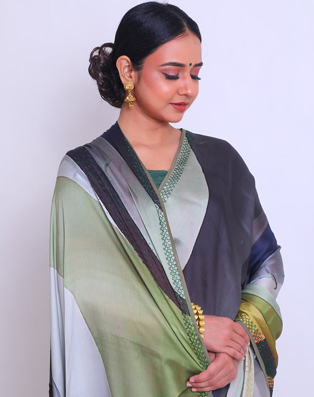The multi-blended saree with green stone embroidery on the border, pallu, and all over the drape - BLN01368