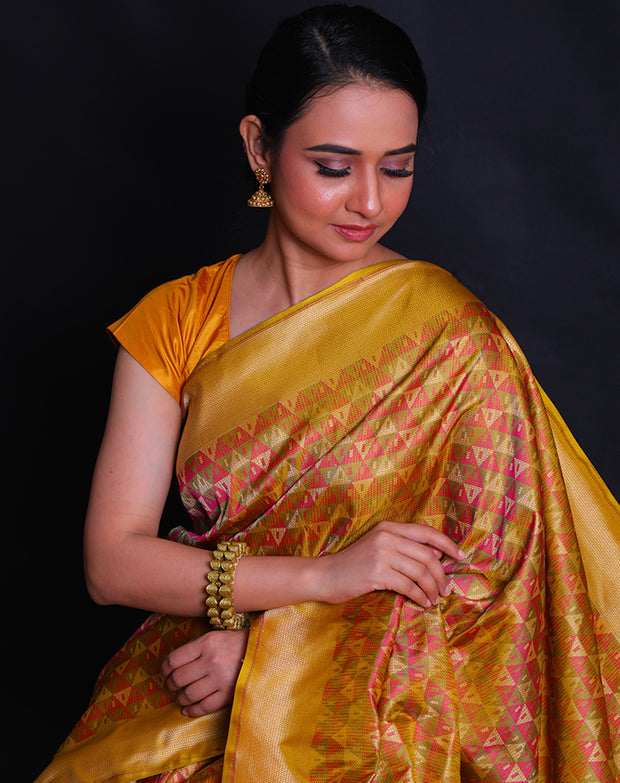 The green Banarasi silk saree with multi-colored woven design all over the drape.- BSK010580