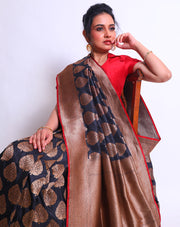A Black Handloom Silk saree with antique Zari on the border and pallu sounds sophisticated and elegant - BSK08908