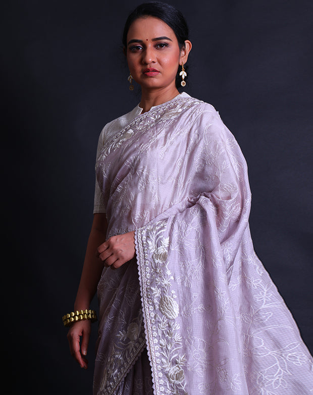 The lilac silk Kota saree with thread embroidery all over the drape sounds lovely and delicate.- EMB03357