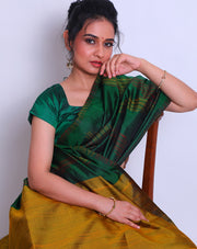 A Bottle Green South Soft Silk saree with a combination of red and yellow lines woven as a design on the border and all over the drape sounds captivating - KSL03091