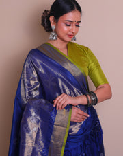 A peacock blue Uppada real zari saree is adorned with small buttis of silver and gold zari scattered throughout the drape, - OPD01736