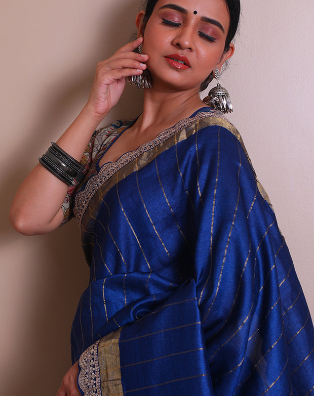 The navy blue embroidered saree with zari lines all over the drape, - EMB03353