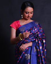 The navy blue pure silk saree combines contemporary elegance with traditional charm.- PTS05304