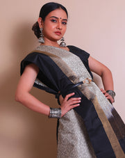 The white soft silk Kanjivaram saree with black woven geometrical designs sounds exquisite - KSL03152