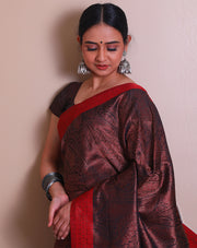 The brown South silk saree with tanchui design woven all over the drape sounds rich and luxurious. - KSL03146