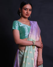 A light green blended saree features a beautiful flower design woven in zari across the drape, - BLN01556