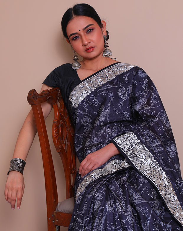 The black blended Tussar saree with Parsi embroidery on the border and pallu sounds absolutely exquisite - BLN01414