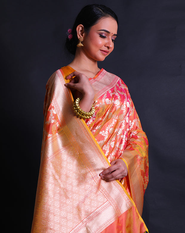 The gold spot Banarasi silk handloom saree with silver zari woven flower design.- BSK010558