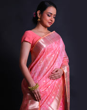 The peach cotton saree with silver zari lines and flower design all over the drape sounds elegant and charming.- FCT011146