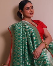 The green Banarsi silk Handloom saree with gold zari woven details all over the drape, border - BSK09932